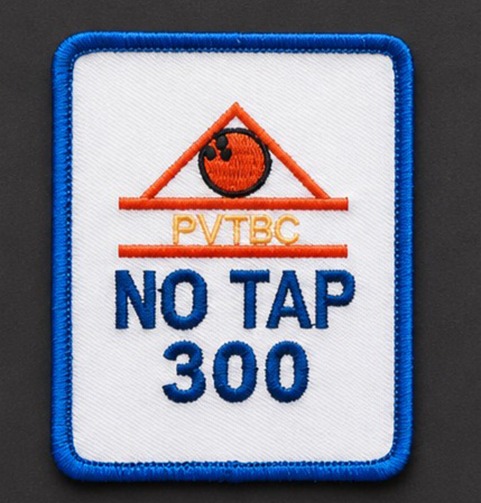 Embroidered patch featuring a triangular design
